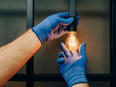 electrician-changes-the-light-bulb-handyman.jpg